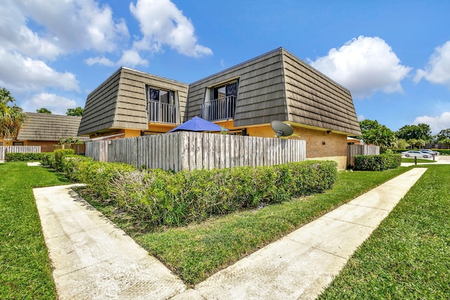 view of property exterior with a lawn