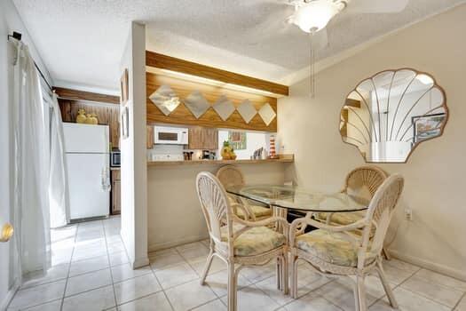 dining room with a textured ceiling and light tile patterned floors