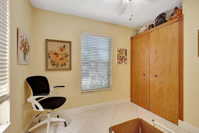 tiled office featuring ceiling fan