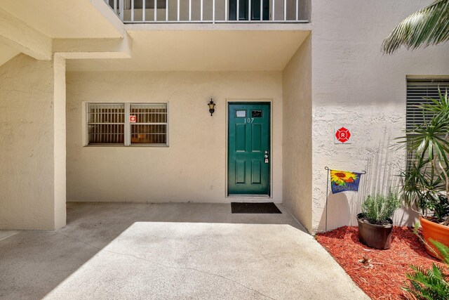 entrance to property with a patio area