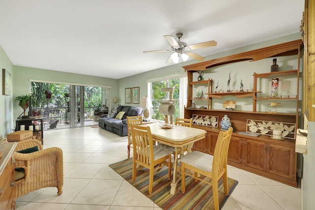 dining area featuring light tile patterned flooring and ceiling fan