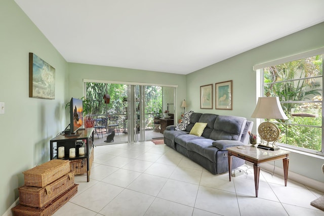 living room featuring light tile patterned flooring and a healthy amount of sunlight