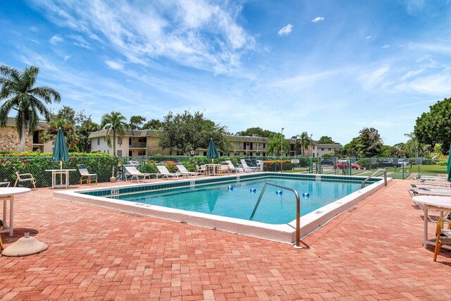 view of swimming pool with a patio