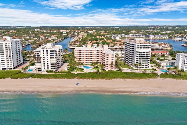 bird's eye view featuring a view of city, a beach view, and a water view