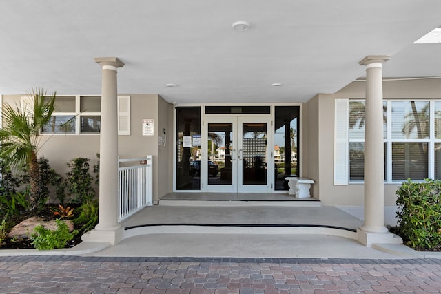 view of exterior entry featuring french doors