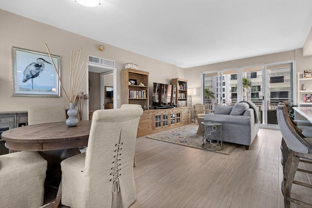 dining room with light wood-style flooring