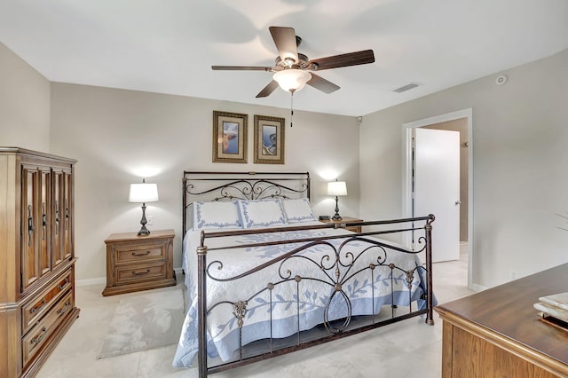 bedroom with ceiling fan and light tile patterned floors