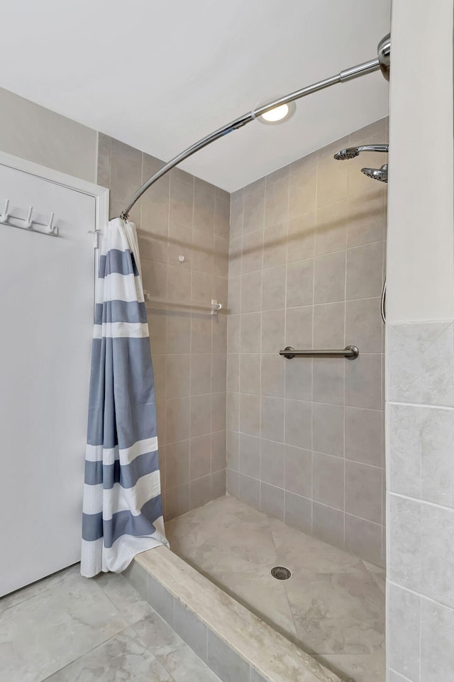 bathroom with tile patterned flooring and curtained shower