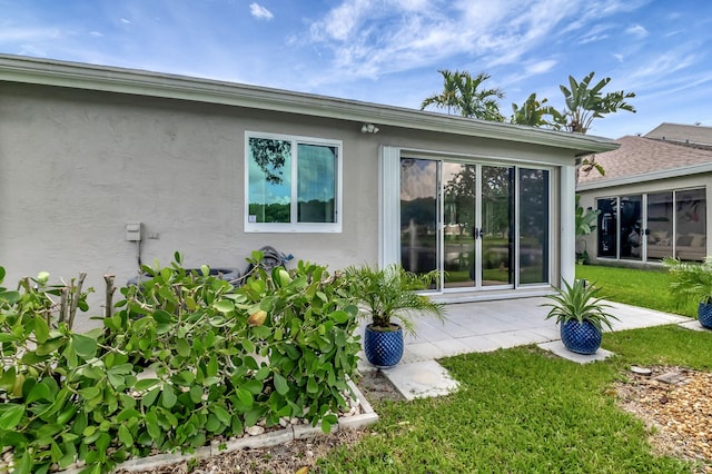 rear view of property featuring a yard