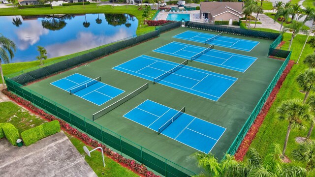 birds eye view of property featuring a water view