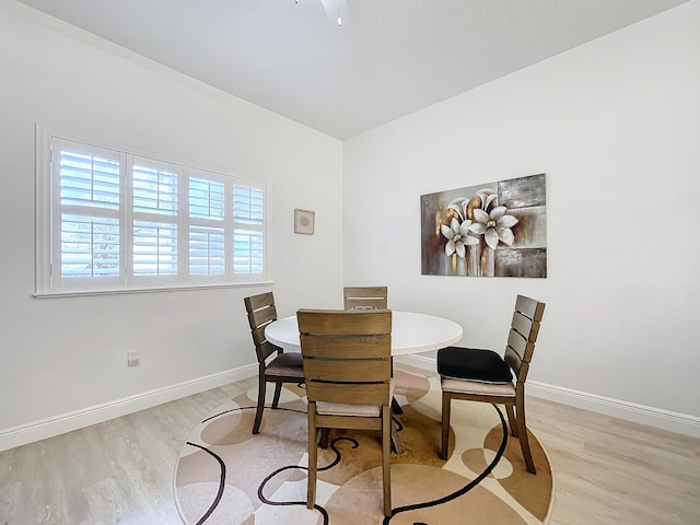 dining area with light hardwood / wood-style floors