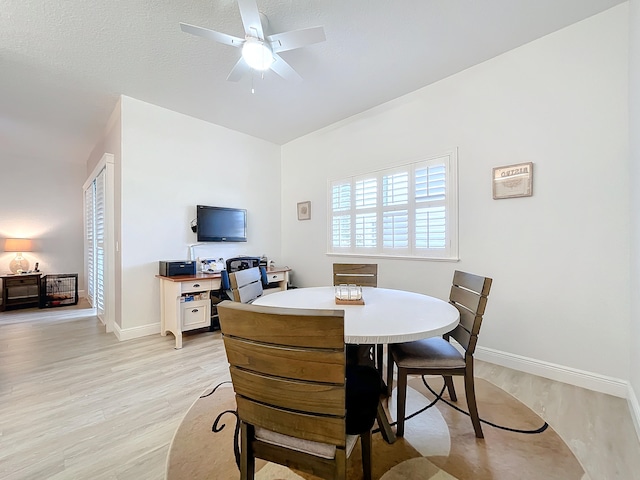 dining room featuring ceiling fan and light hardwood / wood-style floors