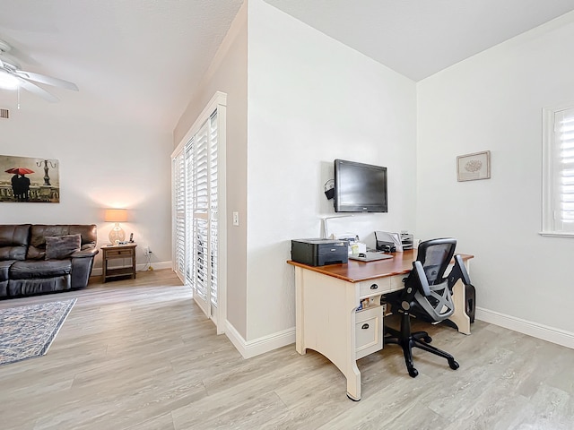 office area with ceiling fan and light wood-type flooring