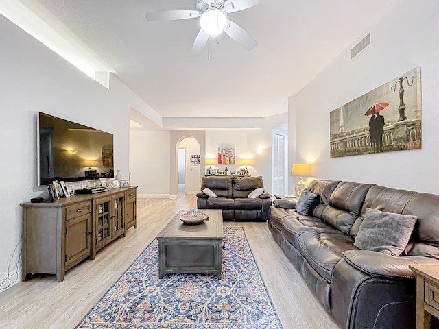 living room featuring ceiling fan and light hardwood / wood-style flooring