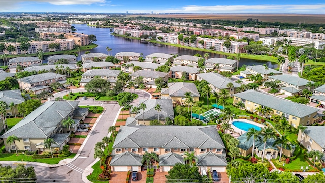 birds eye view of property featuring a water view