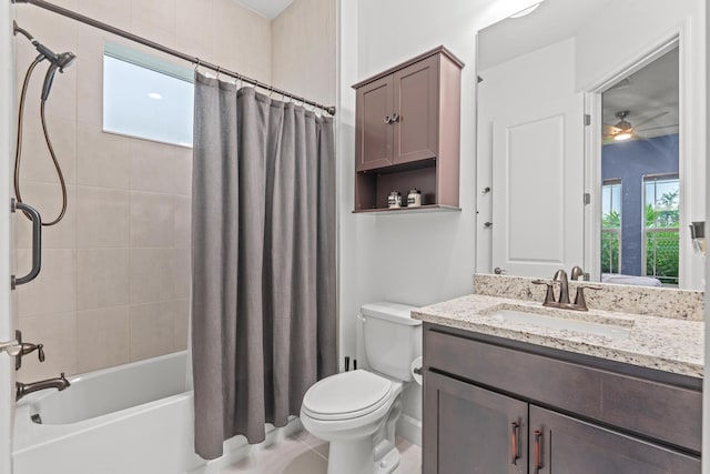 full bathroom with toilet, tile patterned flooring, vanity, ceiling fan, and shower / tub combo with curtain