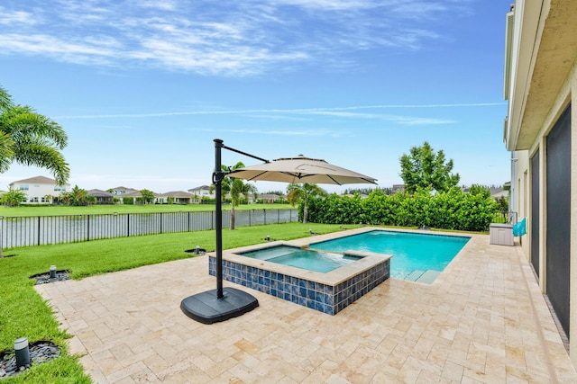 view of swimming pool featuring a patio area, a lawn, and an in ground hot tub