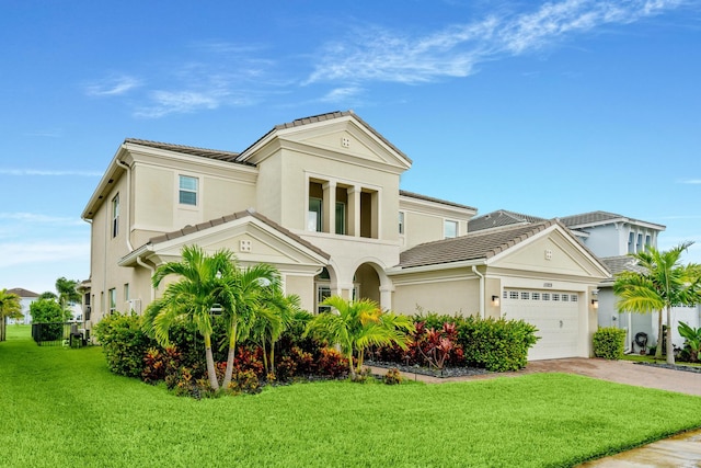 view of front facade with a front yard and a garage