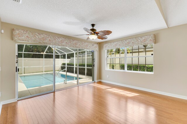 view of swimming pool with ceiling fan