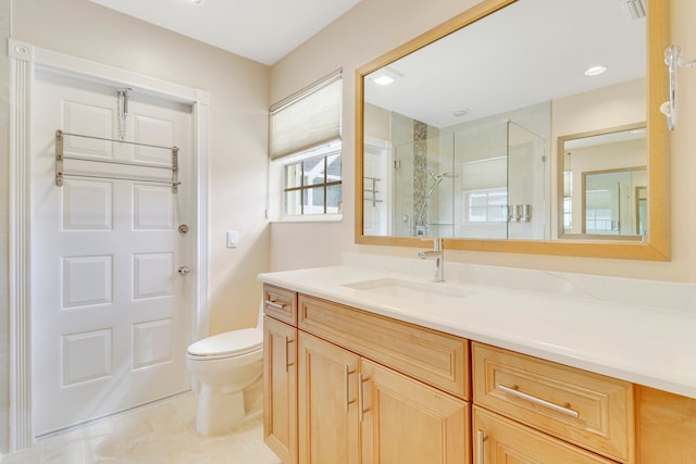 bathroom featuring tile patterned floors, vanity, and toilet