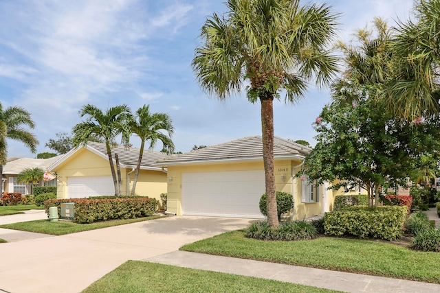 view of front facade with a front lawn and a garage