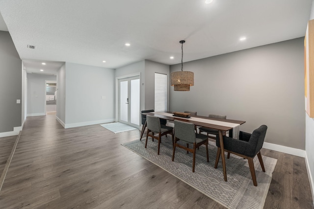 dining area with hardwood / wood-style flooring