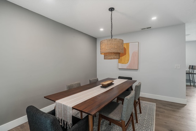 dining area featuring visible vents, baseboards, recessed lighting, and wood finished floors