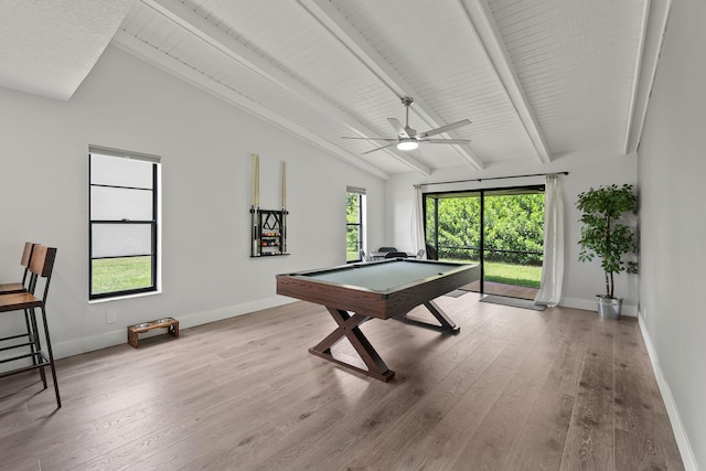 recreation room with ceiling fan, pool table, beamed ceiling, and hardwood / wood-style flooring