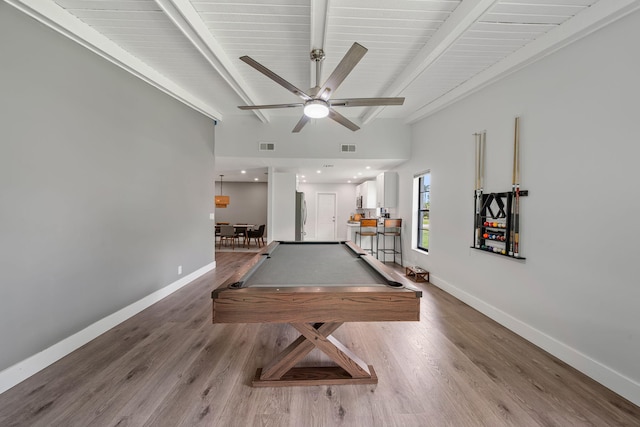 rec room with ceiling fan, wood-type flooring, pool table, and beam ceiling