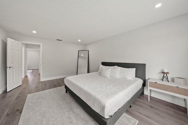 bedroom featuring hardwood / wood-style flooring