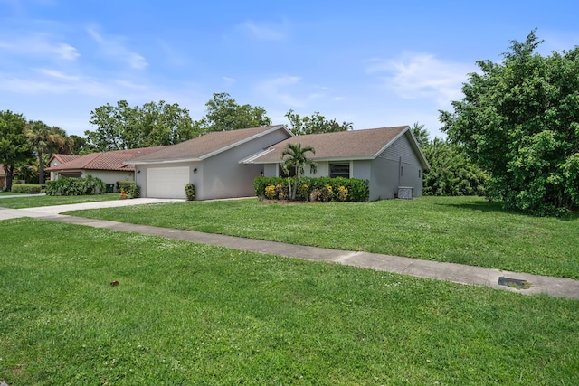 ranch-style house with a garage and a front yard