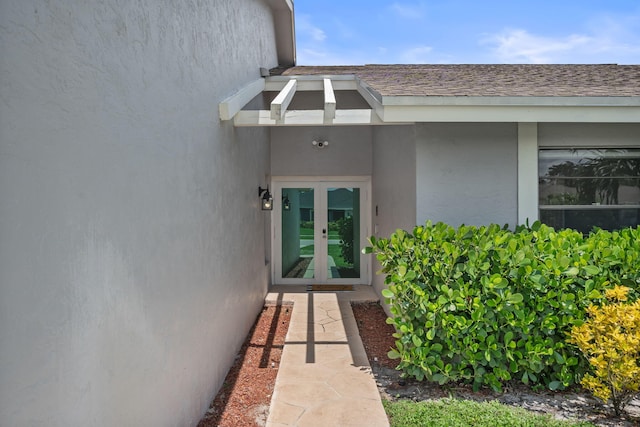 view of exterior entry featuring french doors