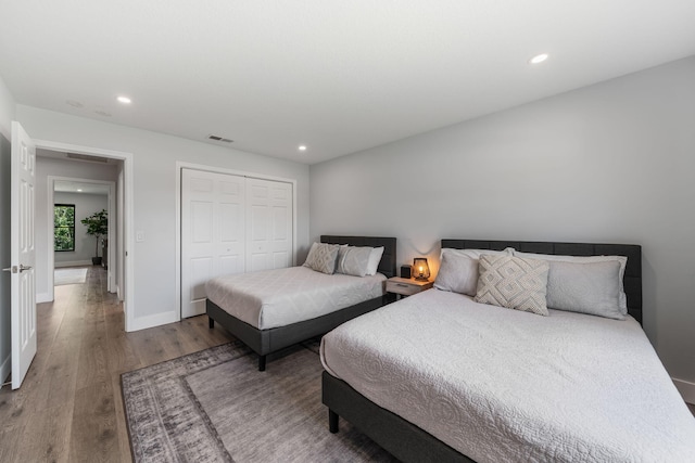 bedroom with a closet and wood-type flooring