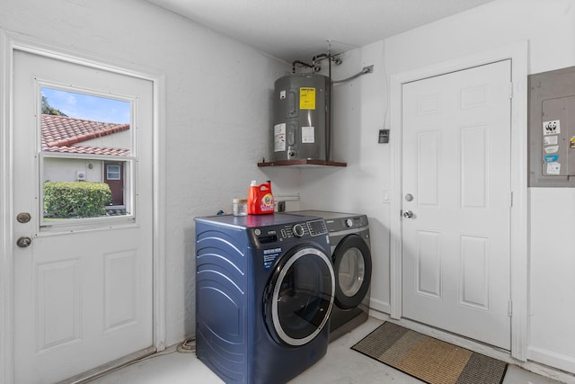 washroom with electric panel, water heater, and separate washer and dryer