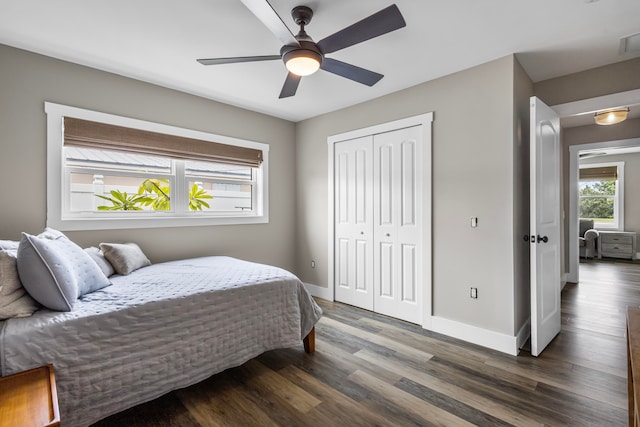 bedroom featuring hardwood / wood-style flooring, a closet, and ceiling fan