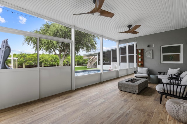 sunroom / solarium with ceiling fan and a healthy amount of sunlight