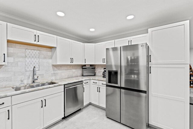 kitchen with sink, appliances with stainless steel finishes, and white cabinetry