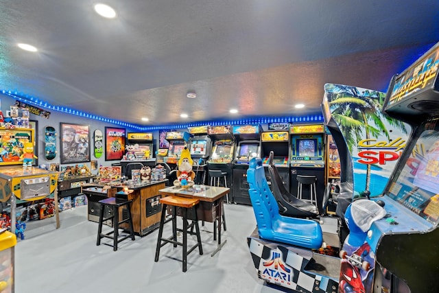 game room featuring a textured ceiling