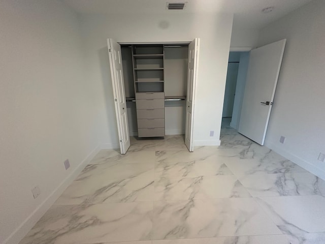 unfurnished bedroom featuring a closet