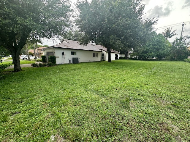 view of yard with central AC unit