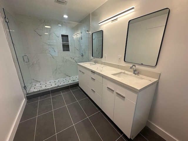 bathroom with an enclosed shower, tile patterned flooring, and vanity