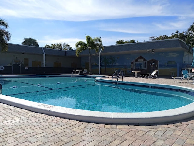 view of swimming pool with a patio