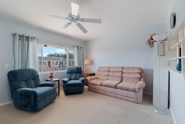 carpeted living room featuring ceiling fan