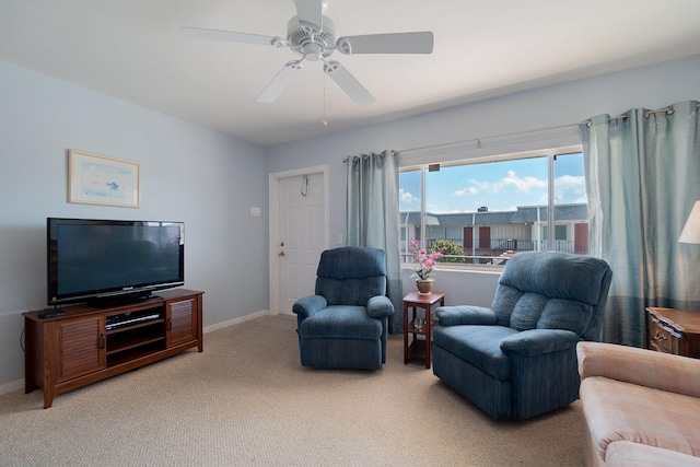 carpeted living room featuring ceiling fan