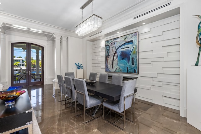 dining space with a chandelier, french doors, and ornamental molding