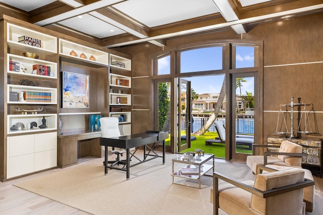 home office with beam ceiling, wooden walls, light hardwood / wood-style flooring, and coffered ceiling