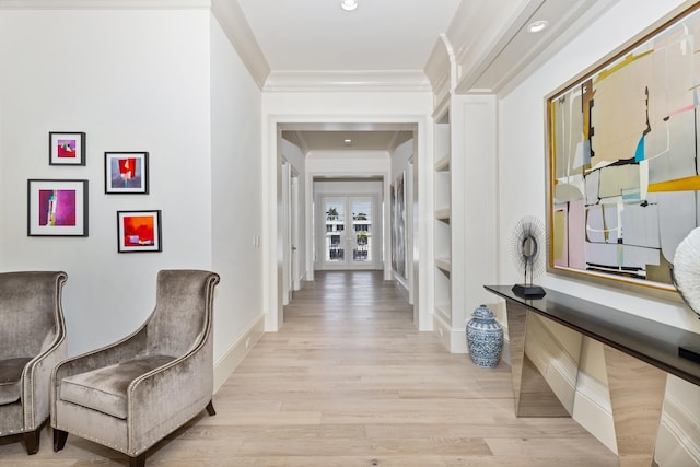 corridor featuring light hardwood / wood-style floors and ornamental molding