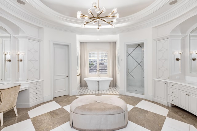 bathroom with a tray ceiling, crown molding, vanity, and a chandelier