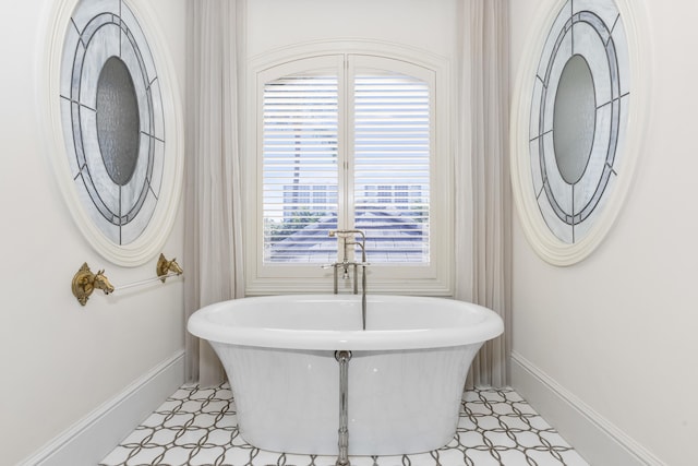 bathroom featuring a tub to relax in