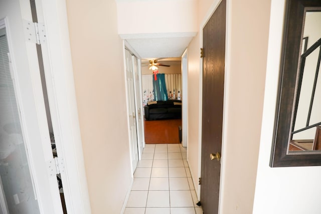 hallway featuring light tile patterned floors